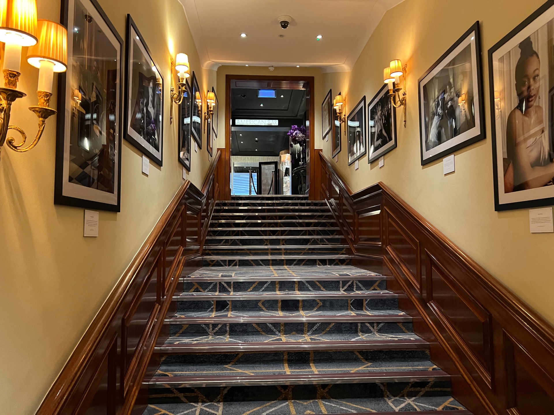 A quiet gallery staircase — an image of the ascent that coaching supports